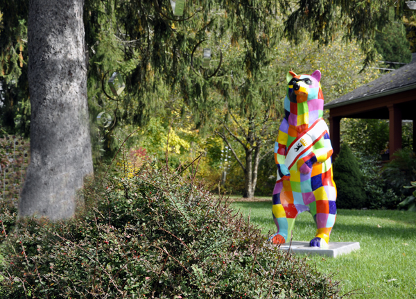 A colorfully painted bear statue